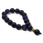Mysterious Stage Rosary with 17 deep navy blue glossy prayer beads and golden detail, ideal for meditation and spiritual elegance.
