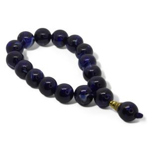 Mysterious Stage Rosary with 17 deep navy blue glossy prayer beads and golden detail, ideal for meditation and spiritual elegance.