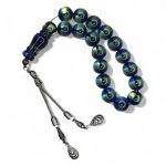 Shining Moon Rosary featuring 33 glossy blue-green reflective beads and silver tassel, inspired by moonlight and peace.