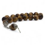 tiger eye tasbih with glossy brown round beads and silver tassel