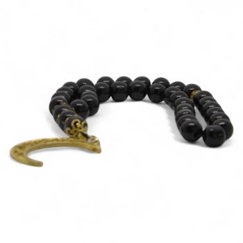 Black crescent tasbeh with glossy black beads and golden moon-shaped finish