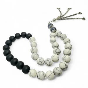Rosary made of black havlite stone with white veined and black matte beads for calm and grounding
