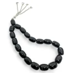 Black agate rosary with 19 polished oval beads for strength and inner peace