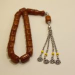 Brown amber rosary with yellow tassels