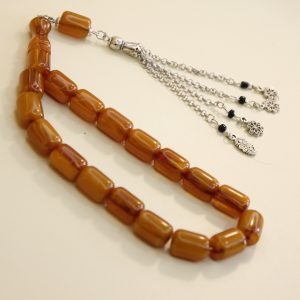Brown squeeze amber with black tassel