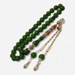 Naqqaşlı yaşıl yumru kəsim sıxma kəhraba